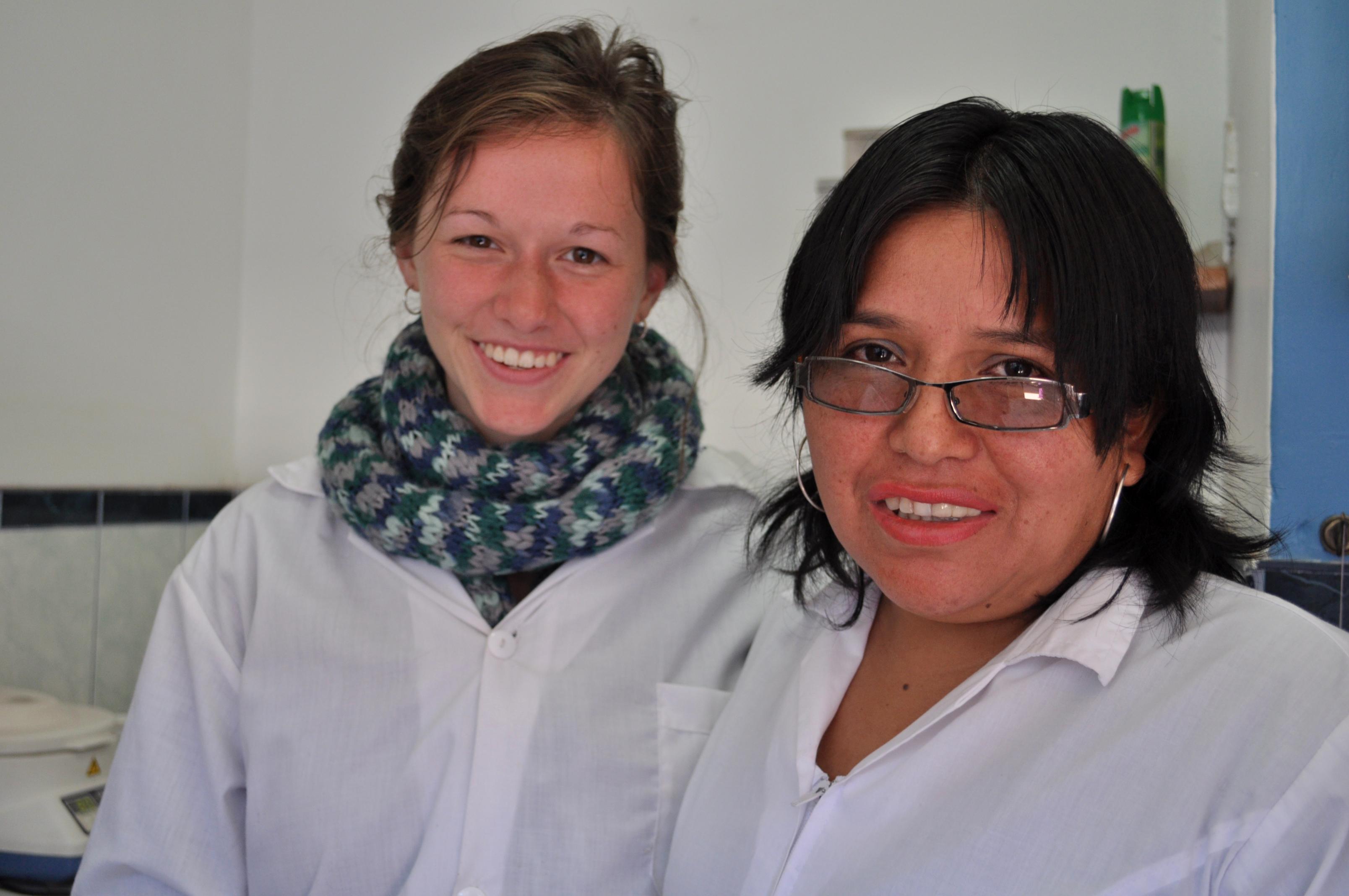 Projects Abroad female intern smiling with a local nurse in the hospital during her midwifery internship in Peru. A female Projects Abroad intern is pictured smiling with a local nurse during her midwifery internship in Peru.